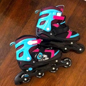 Pink and blue rollerblades